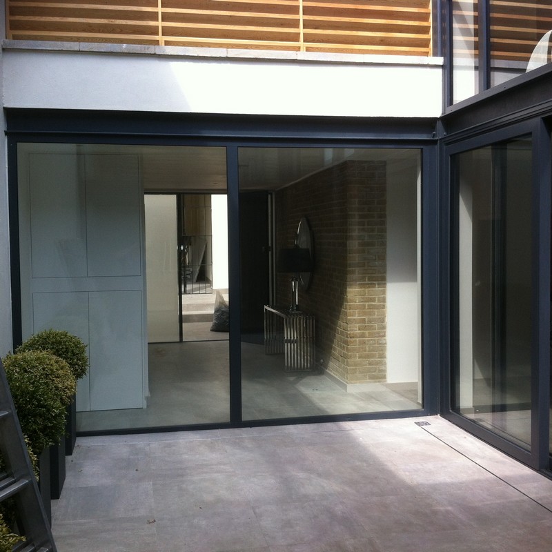 Floor-to-ceiling sliding doors opening to courtyard in Earlsfield