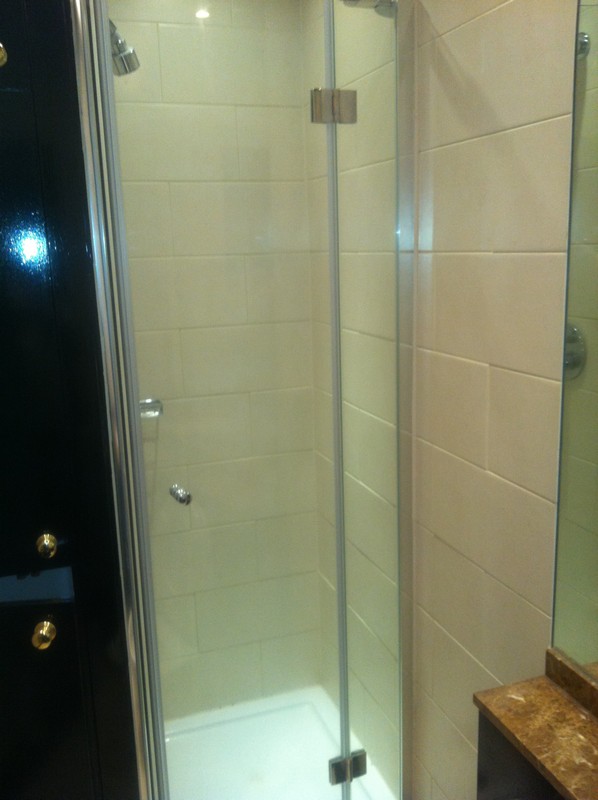 Frameless glass shower enclosure with chrome fittings in Earlsfield