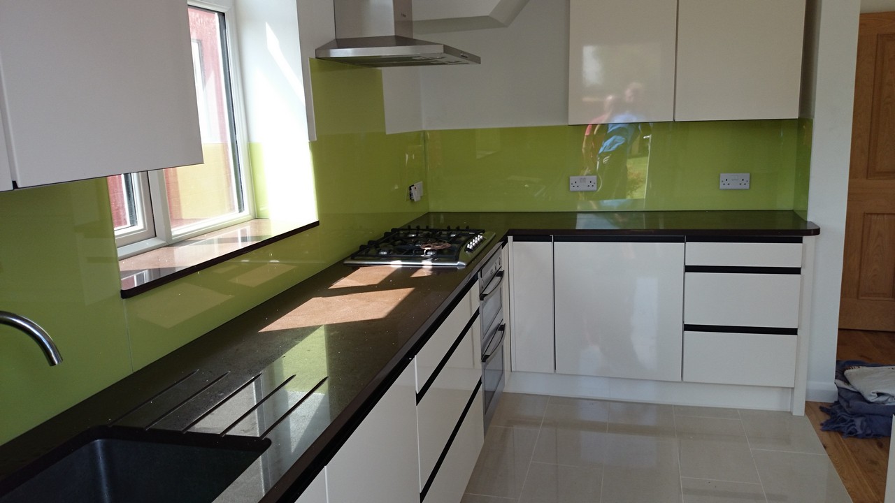 Lime green glass kitchen splashback installed by Earlsfield glaziers